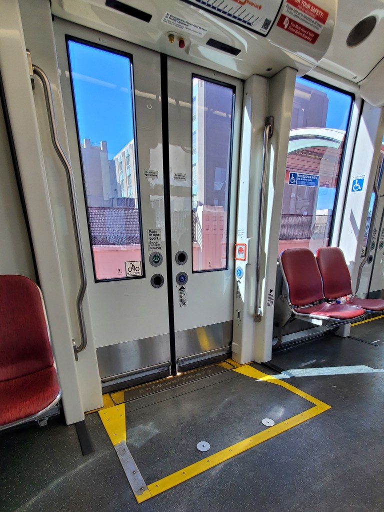 Interior photo of a trolley coach showing the accessibility ramp.